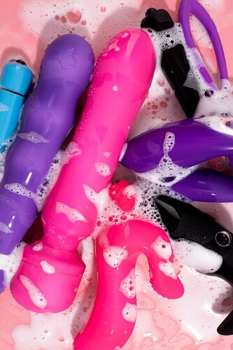 close-up-cleaning-sex-toys_23-2149151817
